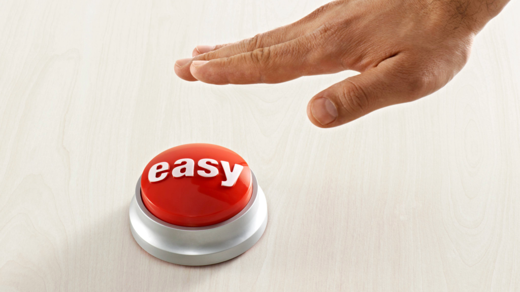 A hand is about to press a red 'easy' button, symbolizing how simple it is to schedule a meeting with me to discuss tailored solutions for improving your sales onboarding process.