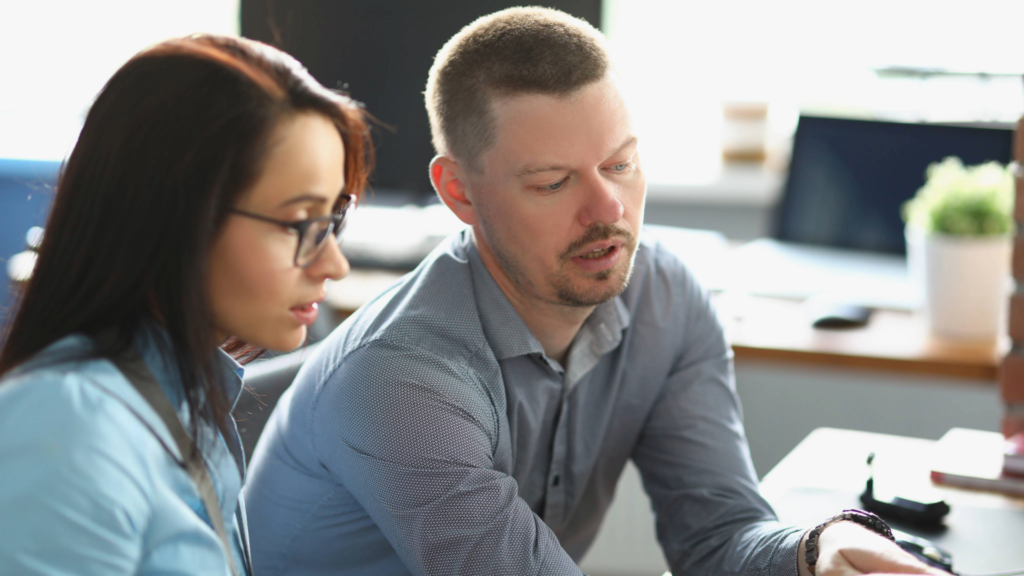 A team of two coworkers setting up their target sequence for networking of their company.