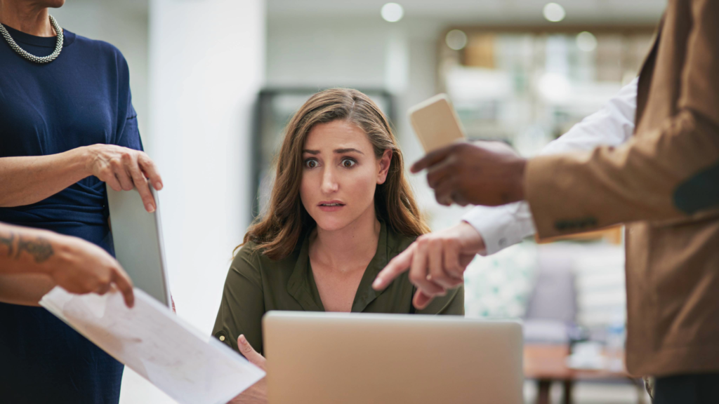 An overwhelmed sales team member trying to balance a heavy workload of projects and stress.